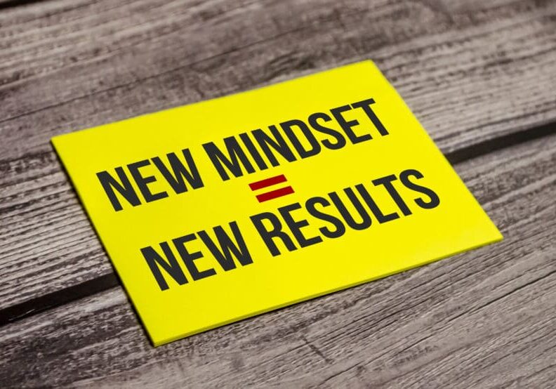 New Mindset - New Results on yellow sticker and wooden background